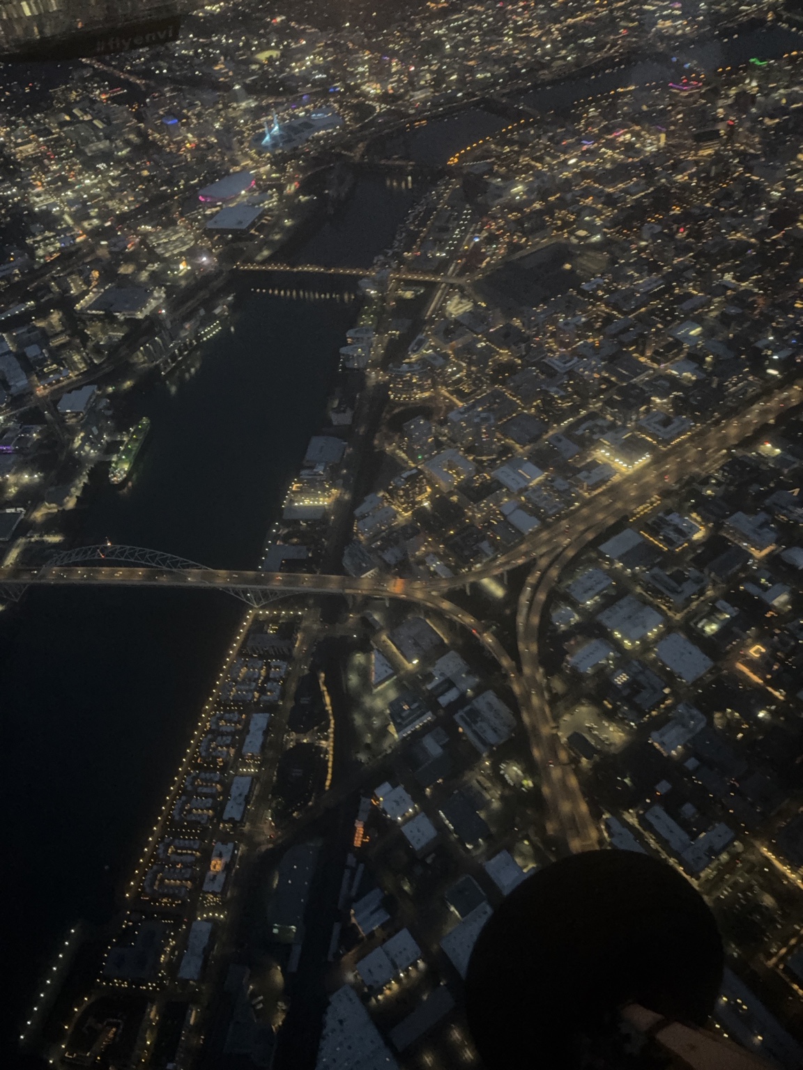 Aerial view of Portland's illuminated riverfront and bridges at night